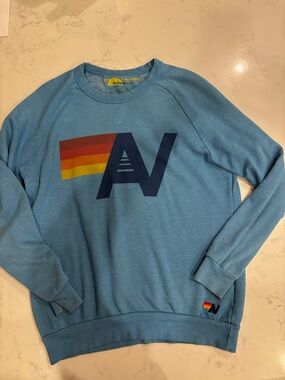 Aviator Nation Blue Crewneck with Retro Rainbow Logo